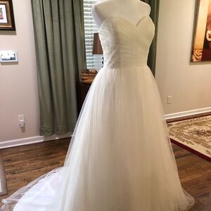 Strapless ball gown, ruched tulle bodice & skirt, w/ pearl belt.David’s Bridal.